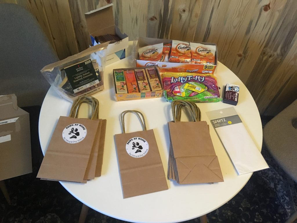 Gift bags with cards and referral slips